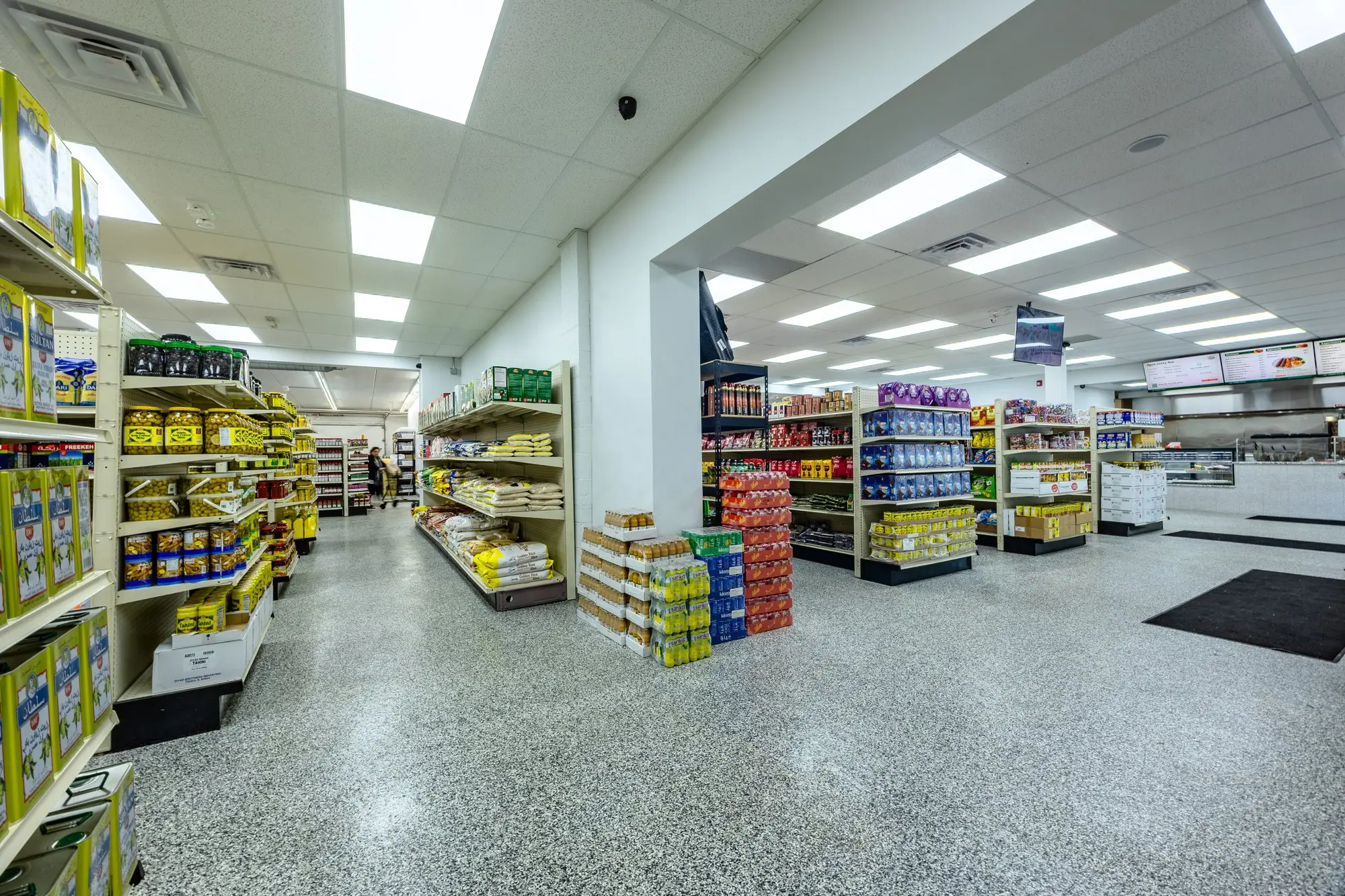 The grocery aisles at ZAMZAM, stocked from end to end.