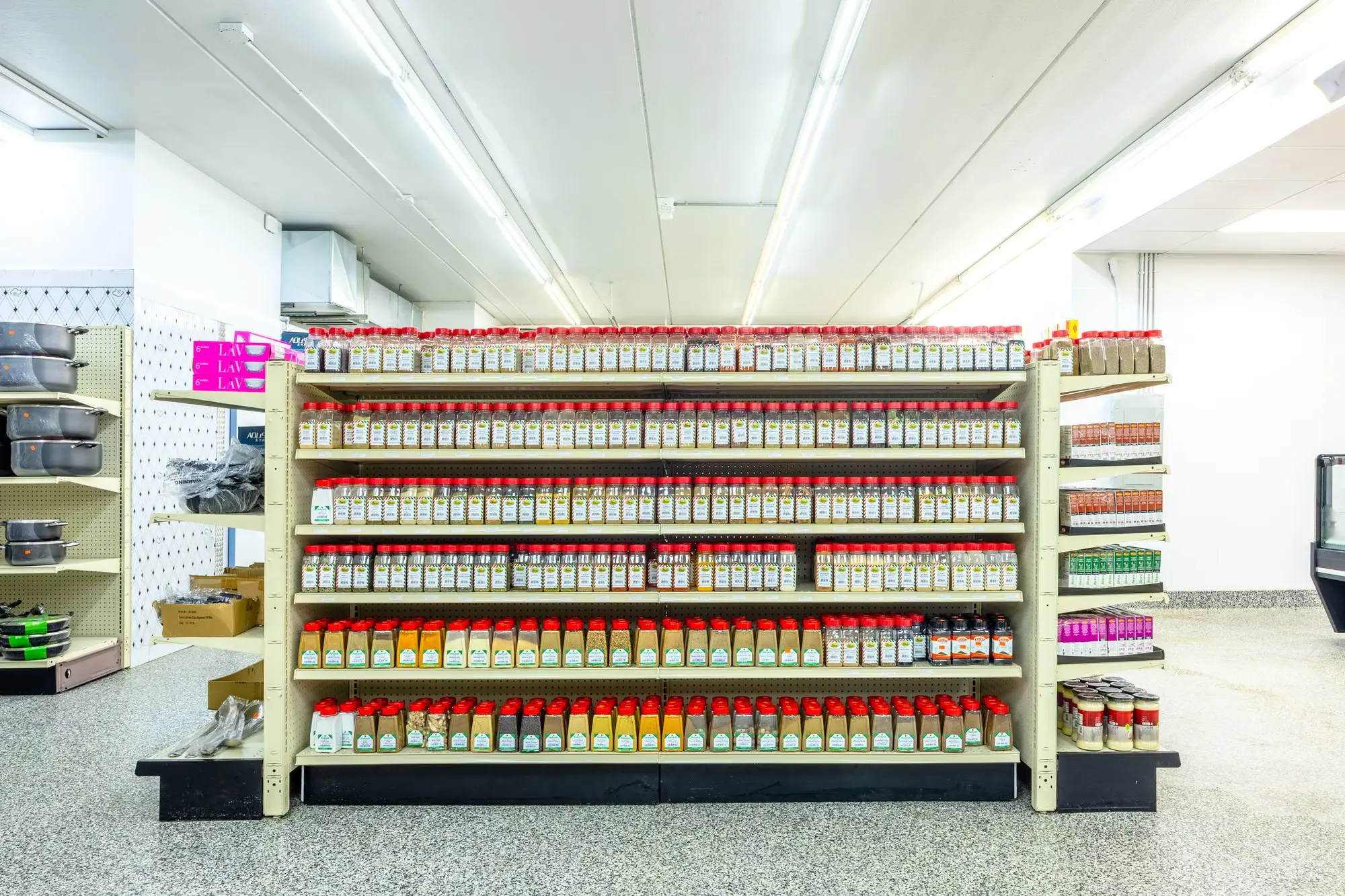 The spice wall at ZAMZAM, packed with seasonings.