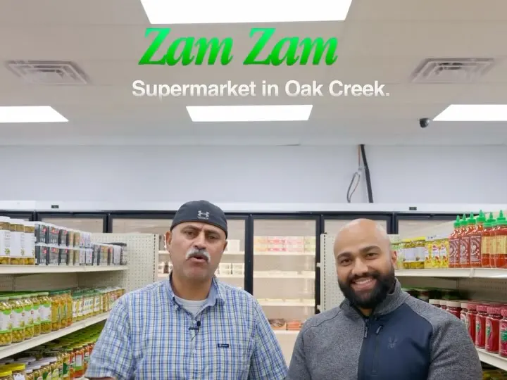 The cover of the video: two men in a ZAMZAM aisle under the title “Zam Zam, Supermarket in Oak Creek.”