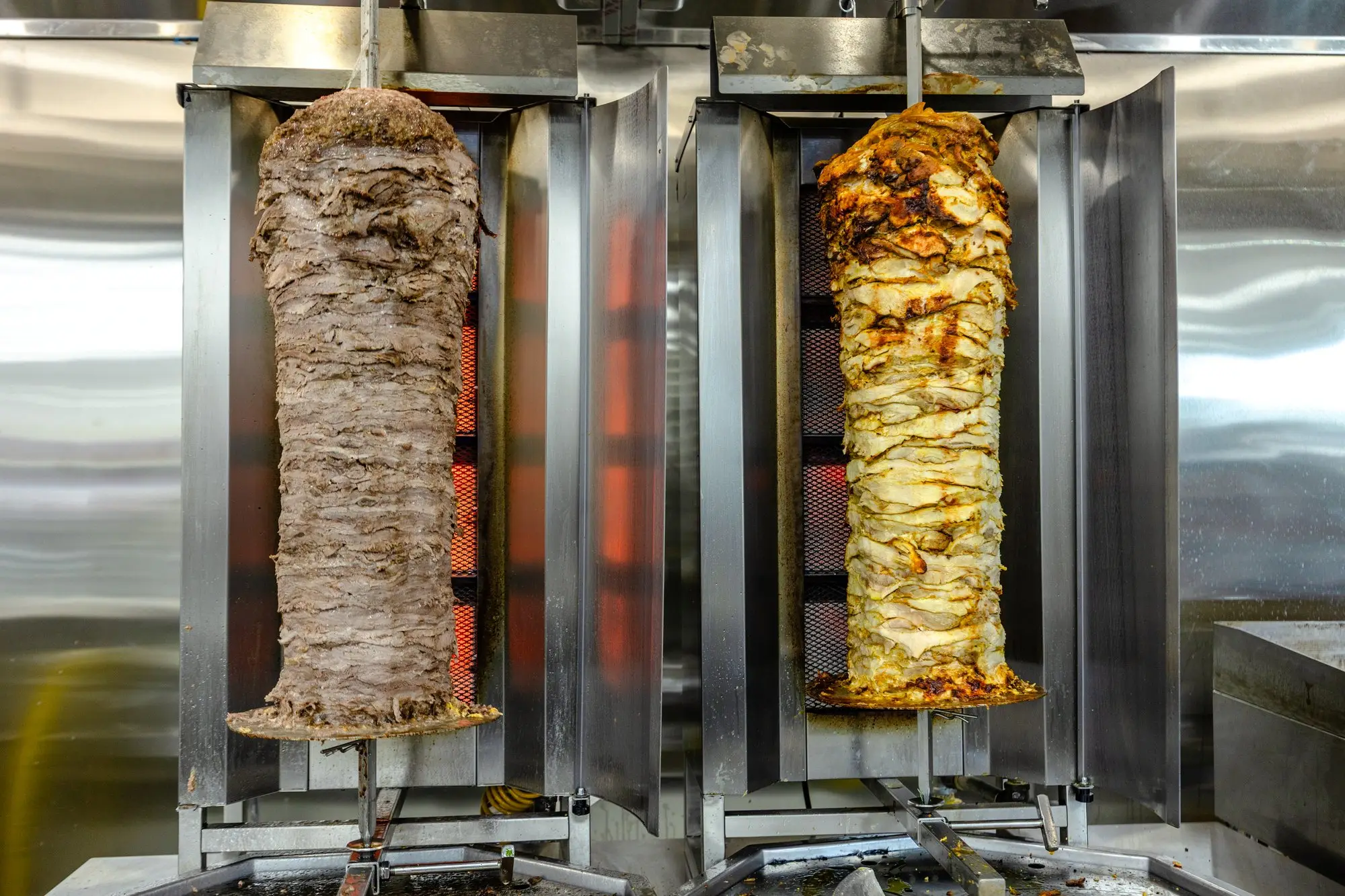Beef and chicken shawarma turning on their spits.